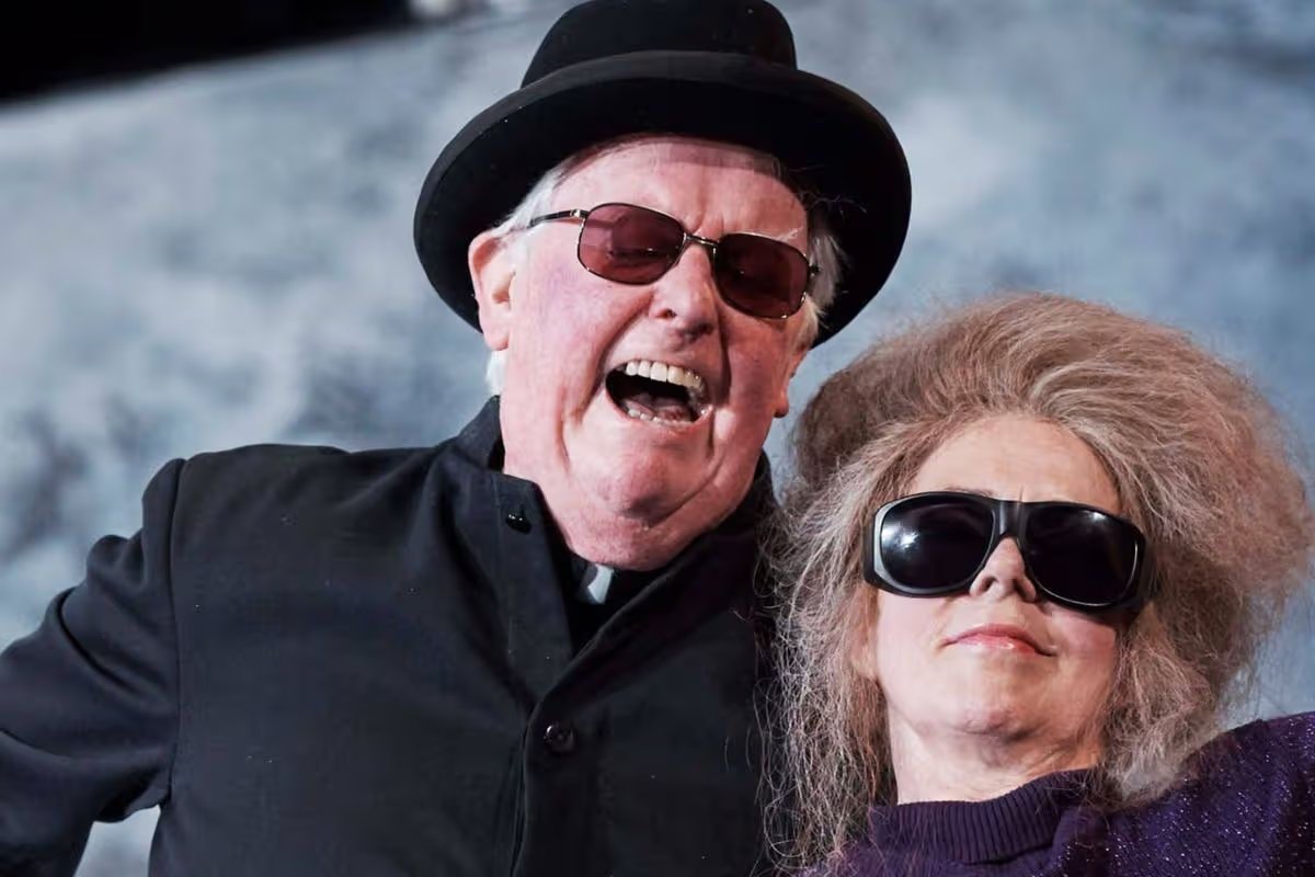 'Wonderful' actor who starred with Michael Caine dies in hospice as tributes paid 0 Des Nealon on stage playing a preist laughing with another actor beside him