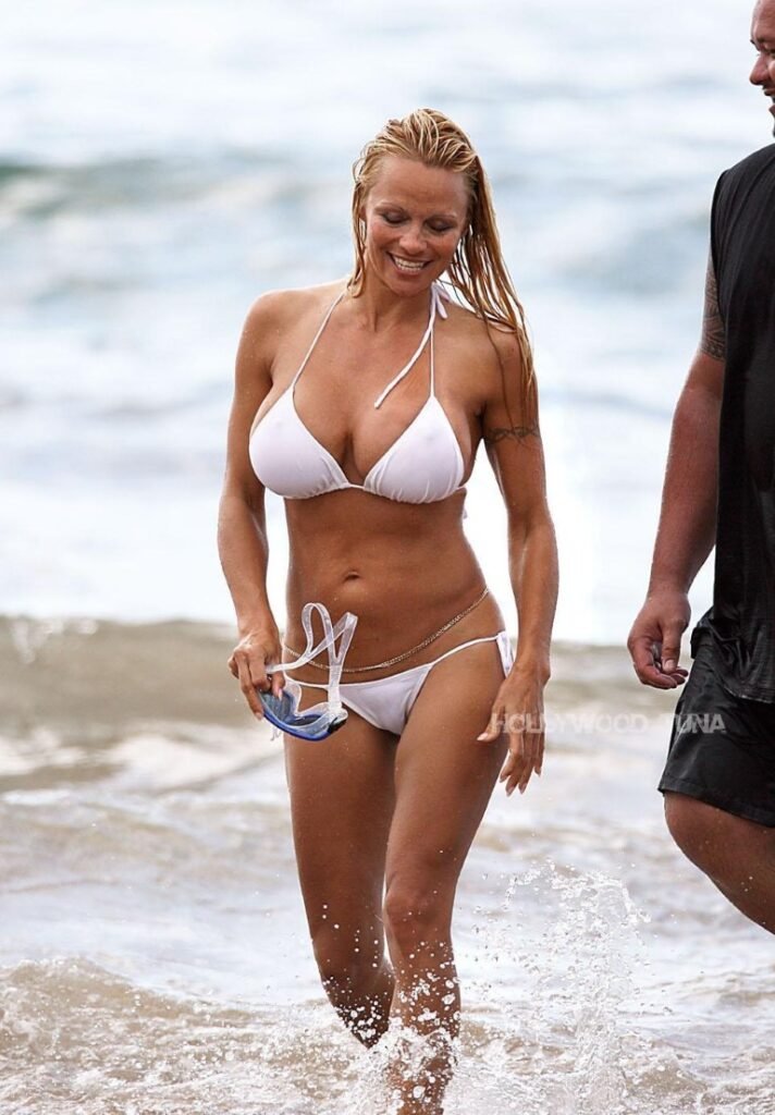 Some throwback pics of Pamela Anderson in white bikini Pamela Anderson white bikni beach3